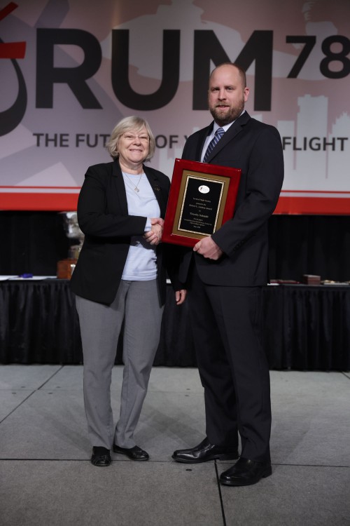 VFS Technical Director Prof. Marilyn J. Smith of Georgia Tech, congratulates the 2022 Robert L. Lichten winner, Timothy Schmidt from Sikorsky, a Lockheed Martin Company. His winning paper, “Automated Optical Rotor Blade Tip Clearance Tracking Using Artificial Intelligence Algorithms,” was presented at Forum 78. He was the winner of the VFS Southern US Region Lichten Competition. 

The Lichten Award was established in 1976 to encourage VFS members who have not previously presented the results of their work at a technical meeting to begin to do so through presentations at local and regional VFS meetings. Each of the ten regions around the world is eligible to select a regional winner to enter the international competition. (VFS photo by Warren Liebmann. CC-BY-SA 4.0)