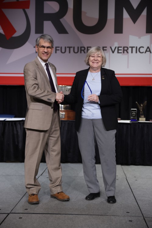 Mike Hirschberg, VFS Executive Director (left) gives a heartfelt thanks to Prof. Marilyn J. Smith, the 2020-2022 VFS Technical Director, for all of her guidance and support over her two-year tenure. She was presented with an acrylic plaque marking her service to VFS. (VFS photo by Warren Liebmann. CC-BY-SA 4.0)