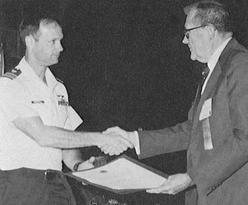 The Captain William J. Kossler, USCG Award presented to US Coastal Guard helicopter crew #1472. Lt. Commander Kevin L. Marshall (left) accepts the Award on behalf of his crew #1472 from Board Chairman Bill Crawford.
AHS (now VFS) 45th Annual Forum and Technology Display held May 22-24, 1989 at Boston, Massachusetts, USA