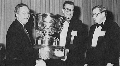 The Howard Hughes Award was given to the Boeing Helicopters 360 Team, in recognition of their design and construction of the world's first all-composite helicopter.
In photo, Ken Grina (right), representing the Boeing 360 Team, receives the Howard Hughes Award from Norm Hirsh (left) and Bill Crawford.
AHS (now VFS) 44th Annual Forum and Technology Display, July 16-18, 1988 at Washington, D.C., USA