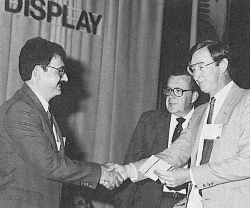 The Robert L. Lichten award presented to Brian Hamilton (left), MCDonnell Douglas Helicopter Company, by Technical Chairman Andy Logan and President Crawford, his lecture for his paper, "Optimal Design of an Advanced Composite Rotating Flexbeam."

AHS (now VFS) 44th Annual Forum and Technology Display, July 16-18, 1988 at Washington, D.C., USA