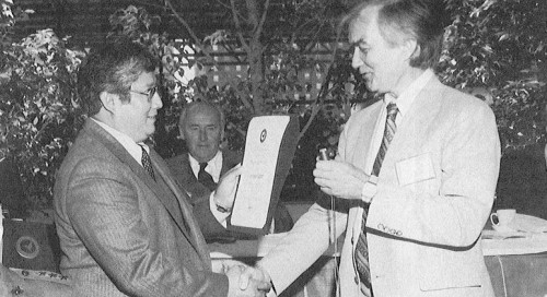 Lewis Neri (left) receives the Society's Chapter Net Growth Award on behalf of the St. Louis Chapter from AHS National Membership Chairman Euan Hooper. Neri was also recognized as the winner of the Society's Individual Sponsor Award for bringing the most new members to the Society during the previous year. 

AHS' (now VFS) 39th Annual Forum and Technology Display held May 9-11, 1983 at St. Louise, Missouri, USA