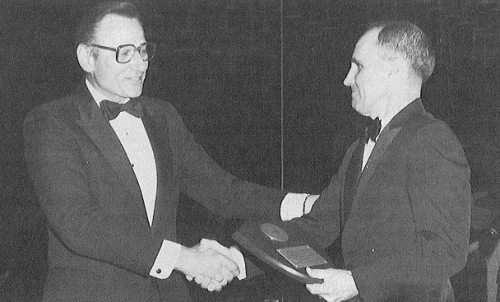 Joe Mallen (left) congratulates and awards Fred Smith a plaque in recogni­tion of his outstanding services to the American Helicopter Society over the past two years.

AHS' (now VFS) 39th Annual Forum and Technology Display held May 9-11, 1983 at St. Louise, Missouri, USA