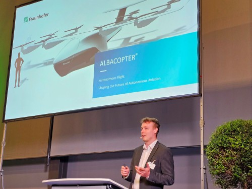 Henri Meess, Fraunhofer IVI, gives a presentation at Airtec 2023, held Oct. 25-27, 2023, at the Messe Augsburg Fair Grounds. VFS organized six insightful sessions on Future Air Mobility. (VFS Staff photo, Oct. 25, 2023. CC BY-SA 4.0)